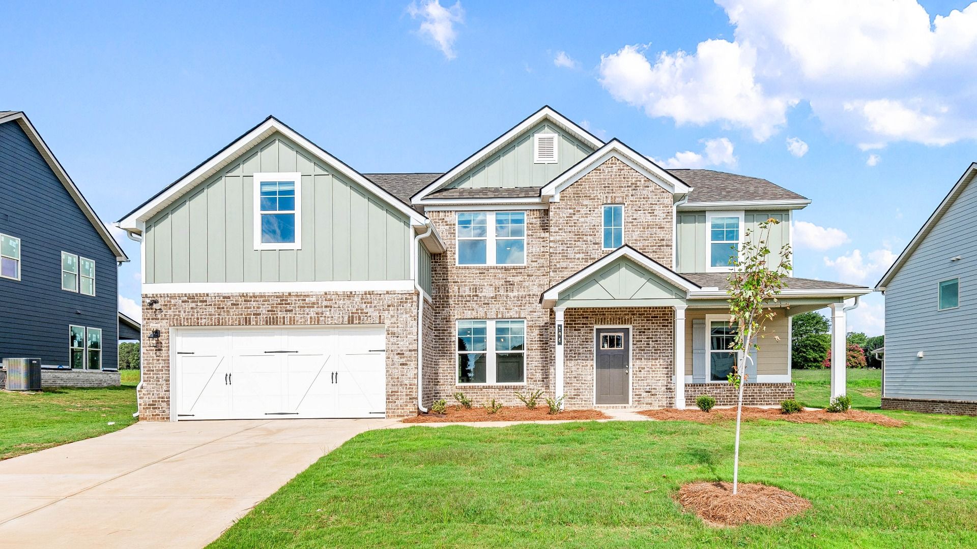 Meridian two-story home featuring brick and siding exterior at Grandview at Millers Mill in Stockbridge, GA.