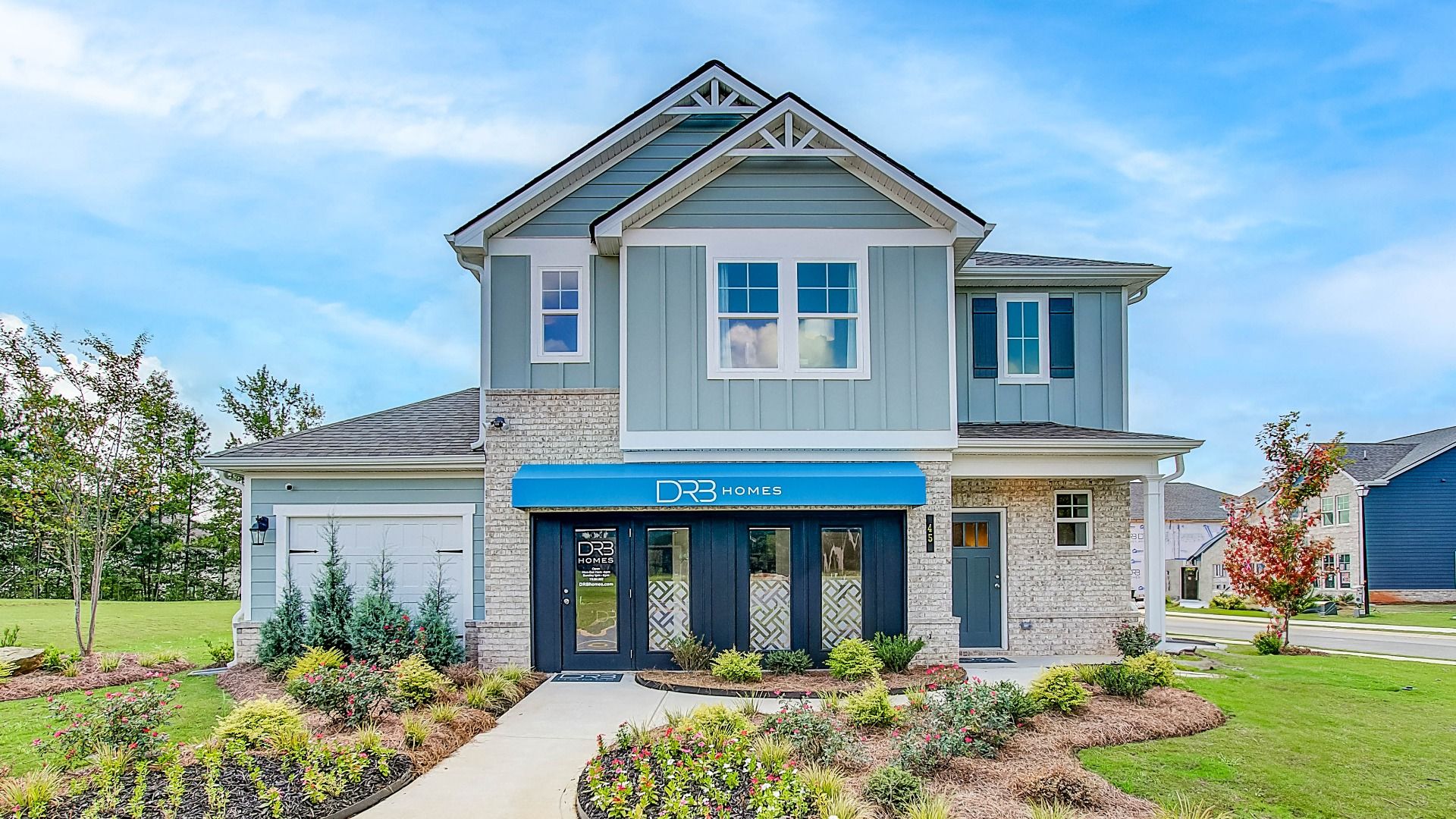 Millhaven model exterior featuring first-level brick and second-level siding at Westminster in Covington, GA.