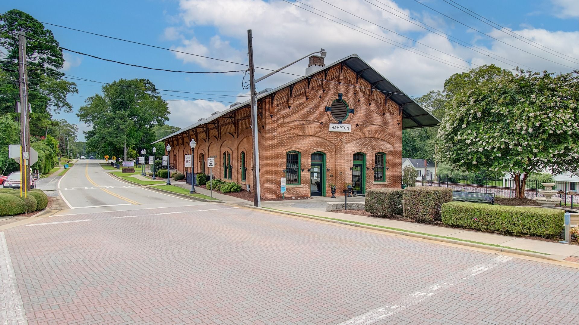 Hampton train station with fountain and bench seating in Hampton, GA near Westwind Estates.
