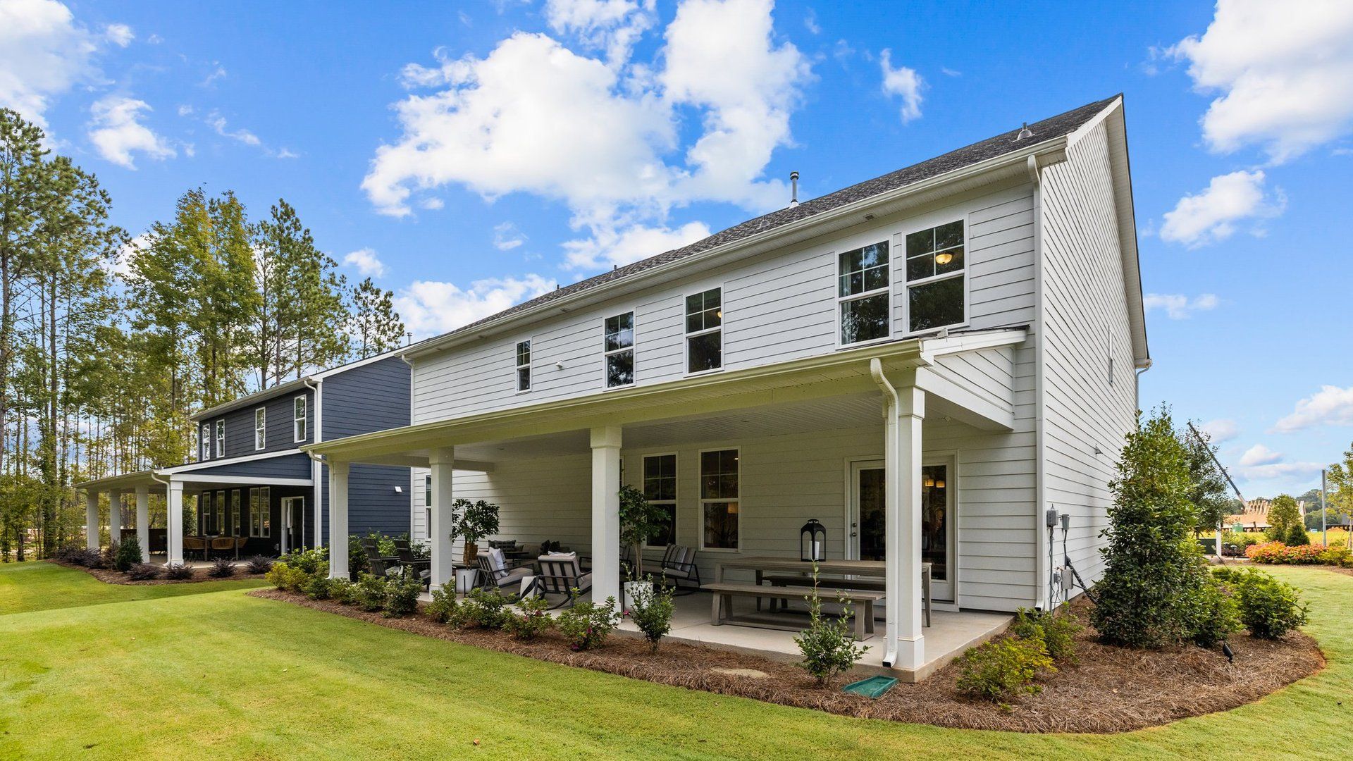 Enjoy the outdoors in comfort in the very spacious covered rear porch with room for outdoor furniture. DRB Homes. York, SC.