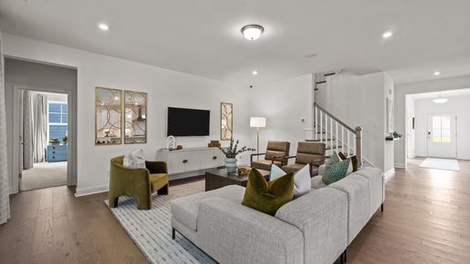 Ample family room with inviting wide-entry hallways in the Townsend plan by DRB Homes at Lakeside Glen in York, SC