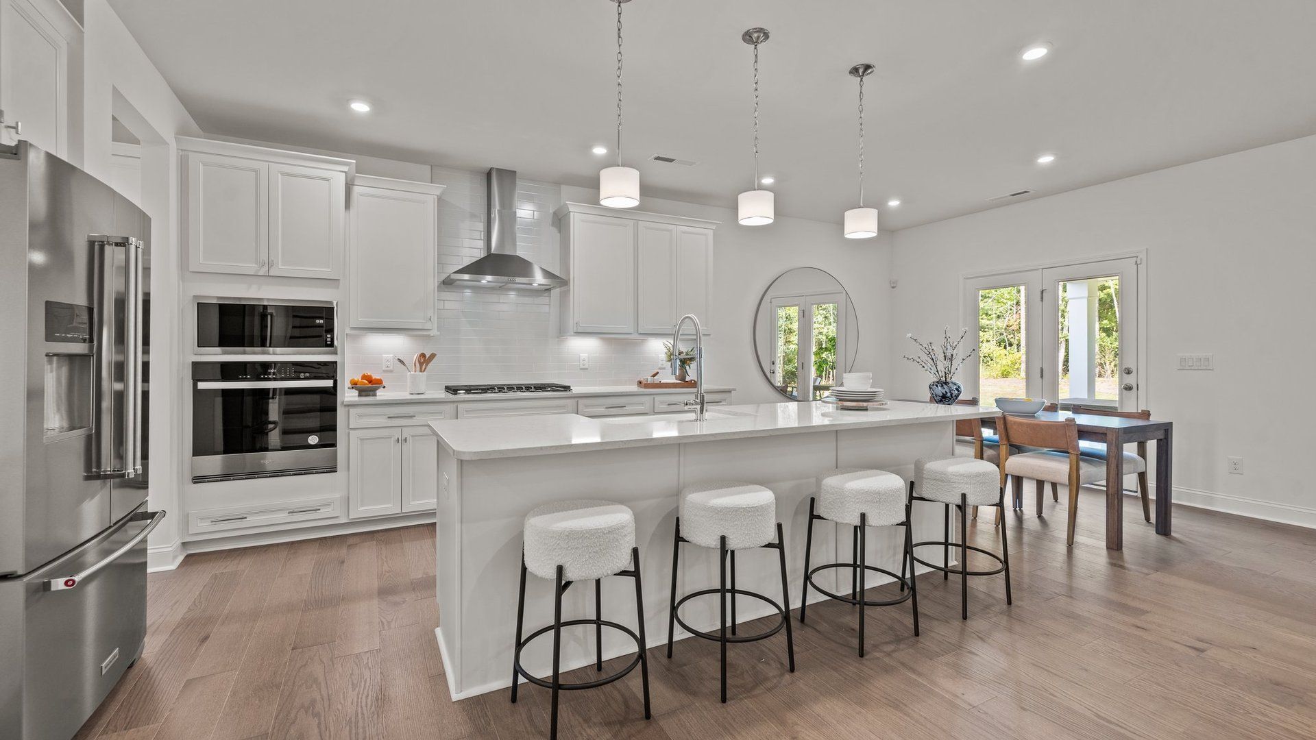 Gourmet Kitchen with wall oven and microwave, vented hood, and eat-in breakfast area at Lakeside Glen in York, SC