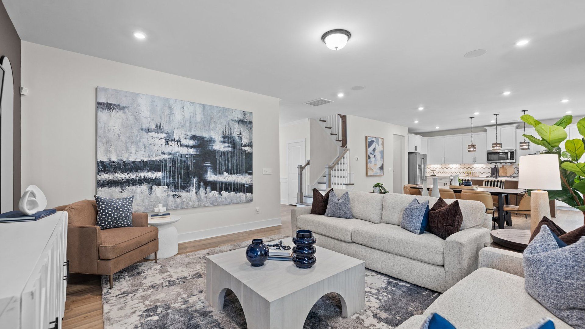 Spacious Open-Concept sunlit Family Room, chef-inspired Kitchen & Dining Area at Lakeside Glen in York, SC