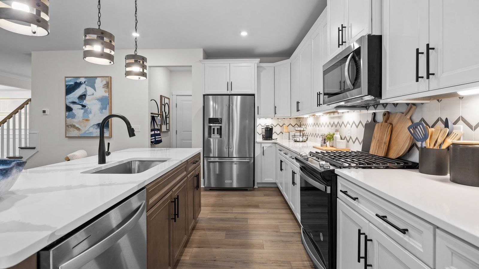Modern kitchen featuring a gas range and a built-in microwave above, and quartz countertops – Lakeside Glen, York, SC
