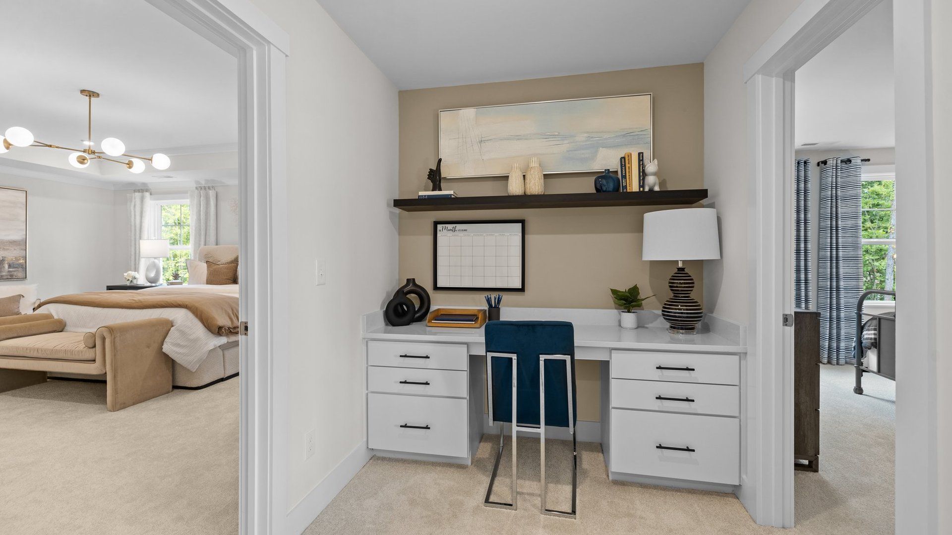 Versatile built-in desk and entrance to the spacious primary bedroom, in Lakeside Glen, York, SC