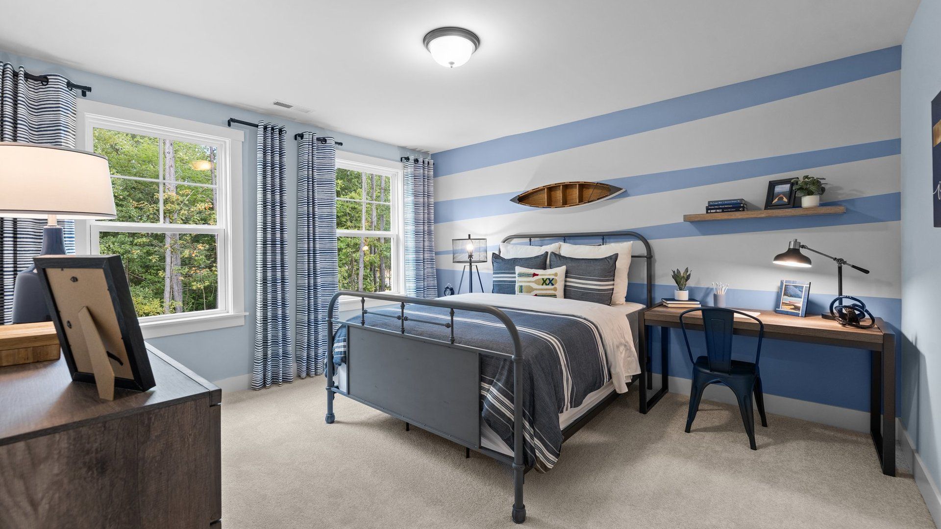 Relax in this spacious bedroom with refined finishes, plush carpeting and oversized windows at Lakeside Glen, York, SC.