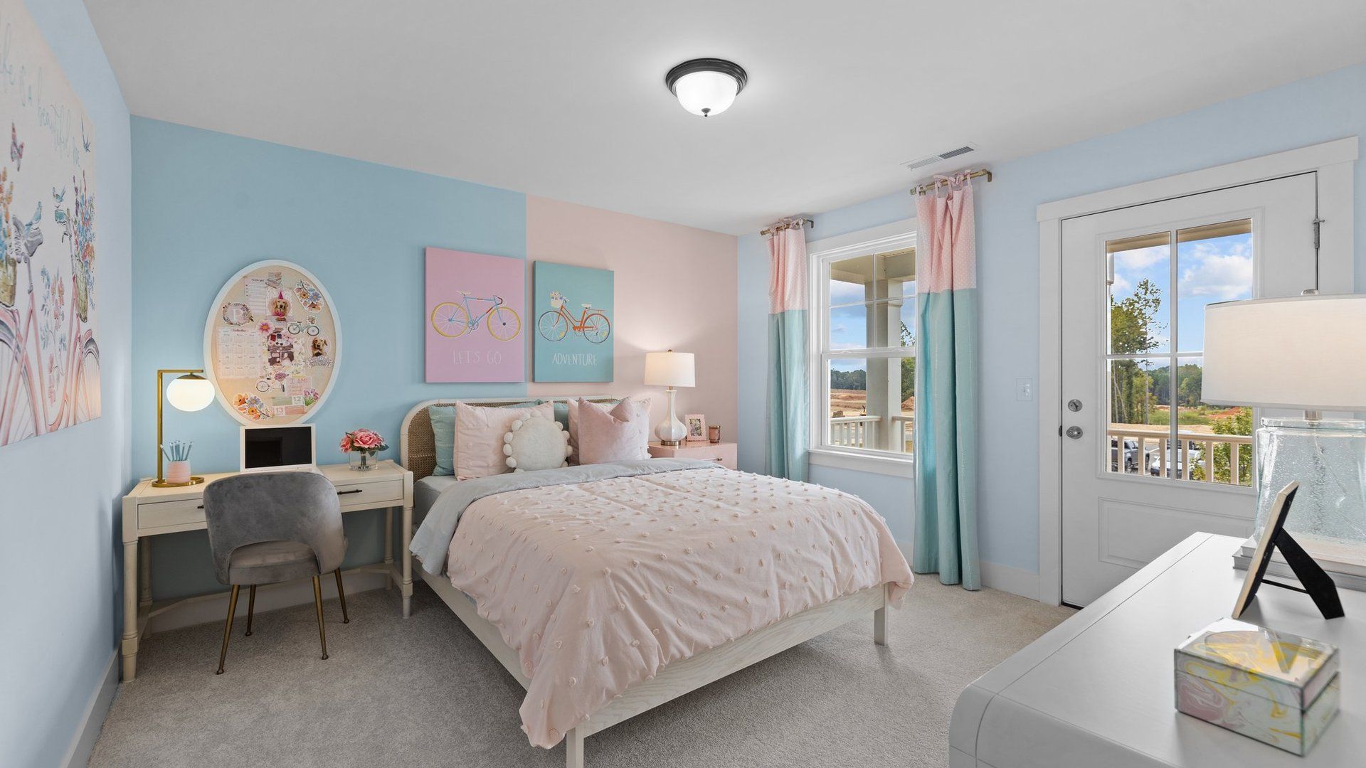 Stylish bedroom features large window and door to private balcony! at Lakeside Glen, York, SC, by DRB Homes.