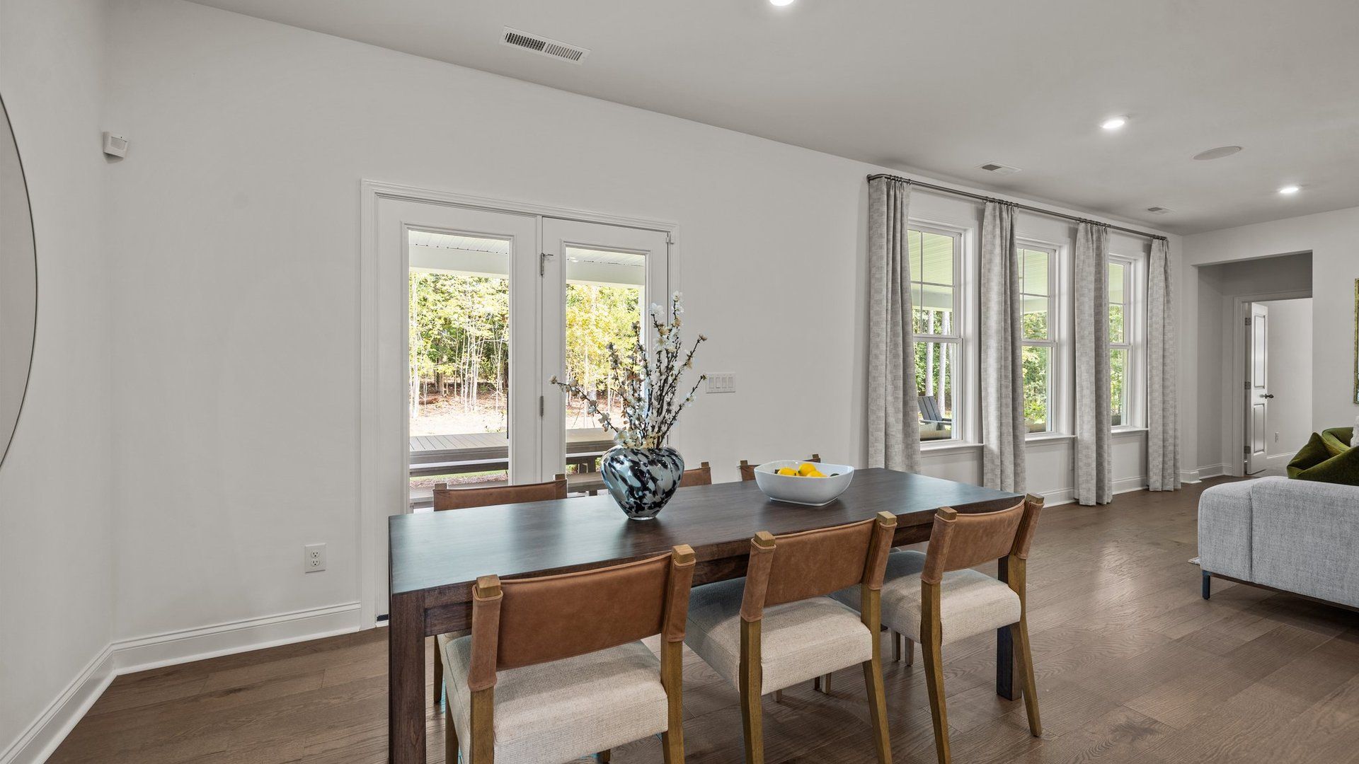 Eat-in breakfast area with large windows and access to the extended rear covered porch, in the Townsend Design by DRB Homes