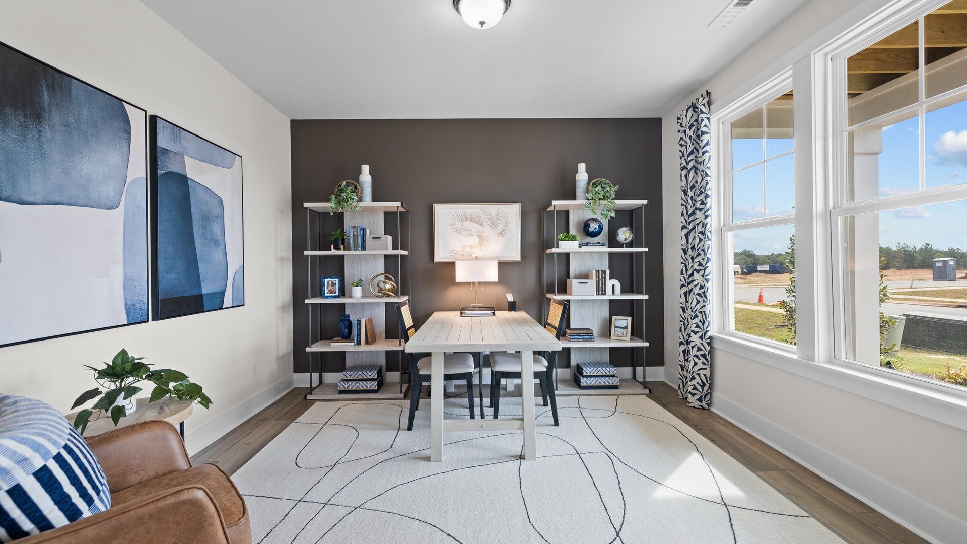 Flexible multi-use study with large windows and elevated ceiling in the Jordan Design by DRB Homes in York, SC