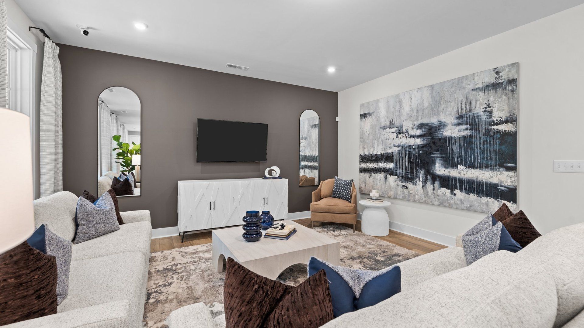Large Family room with elevated ceiling and large windows in the Jordan Design by DRB Homes in York, SC