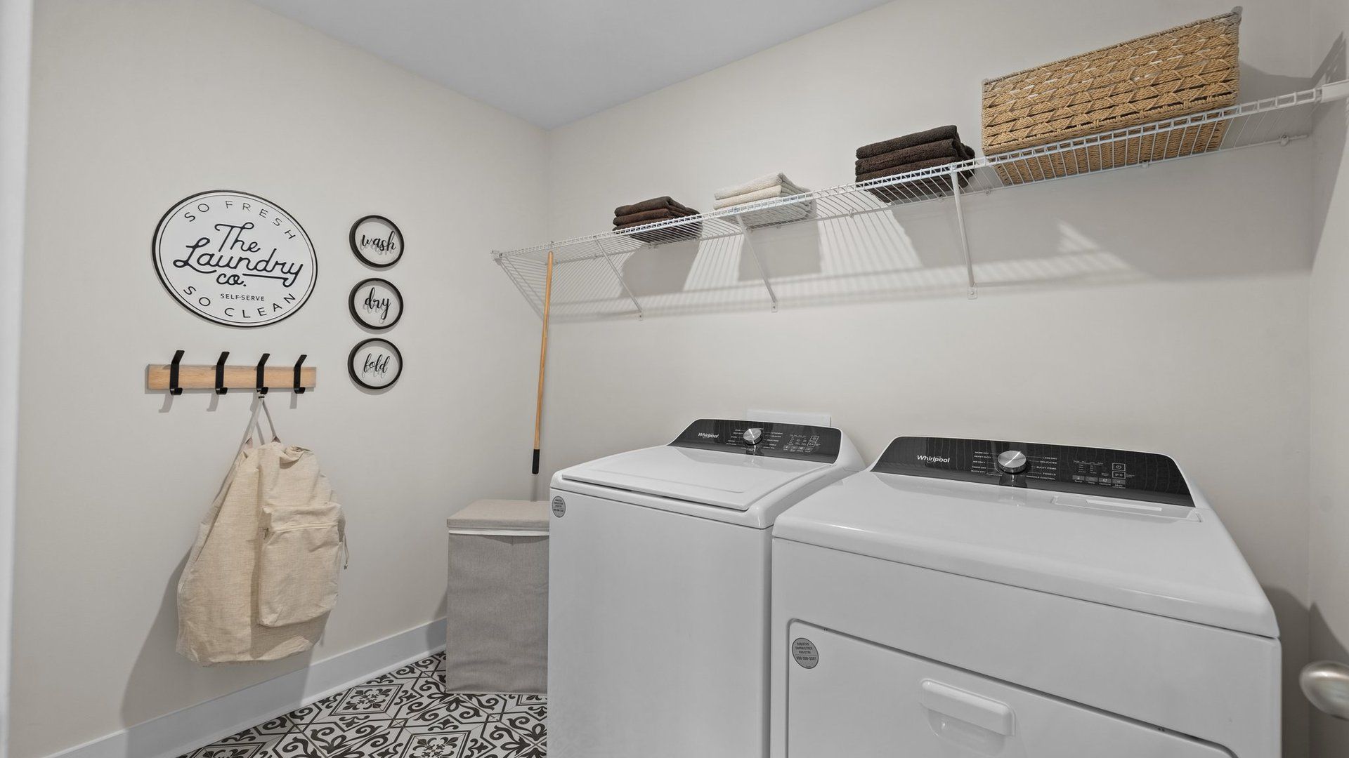 Conveniently located laundry room with premium tile and finishes, in the Jordan Design by DRB Homes in York, SC