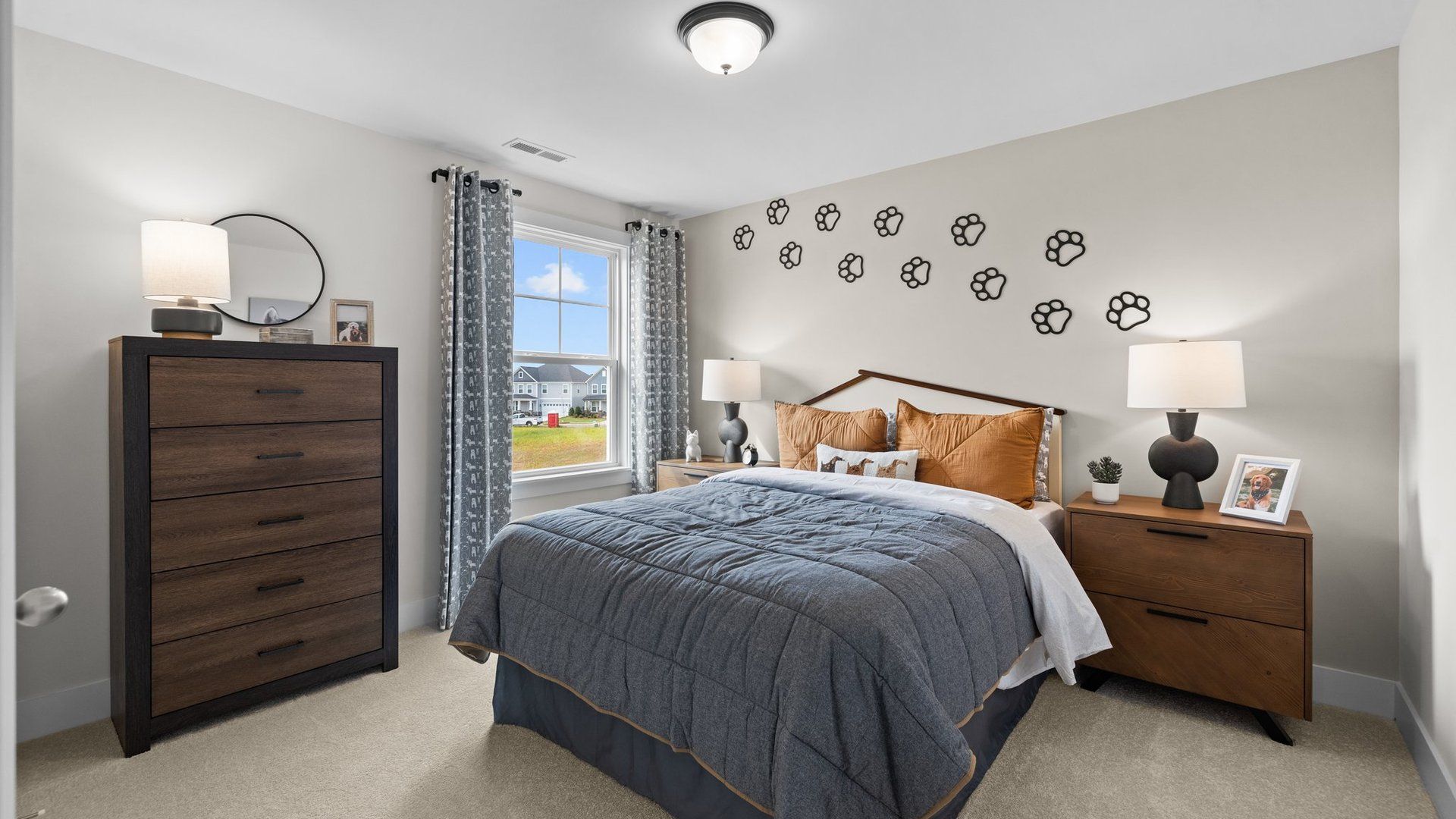 Large secondary bedroom with elevated ceiling, large window, and plush carpeting, in the Jordan Design by DRB Homes, York, SC