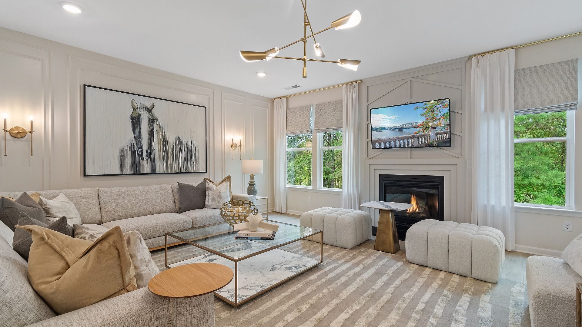 Expansive family room with gas fireplace, ample seating, and neutral color palette at Trinity Park in McDonough, GA.