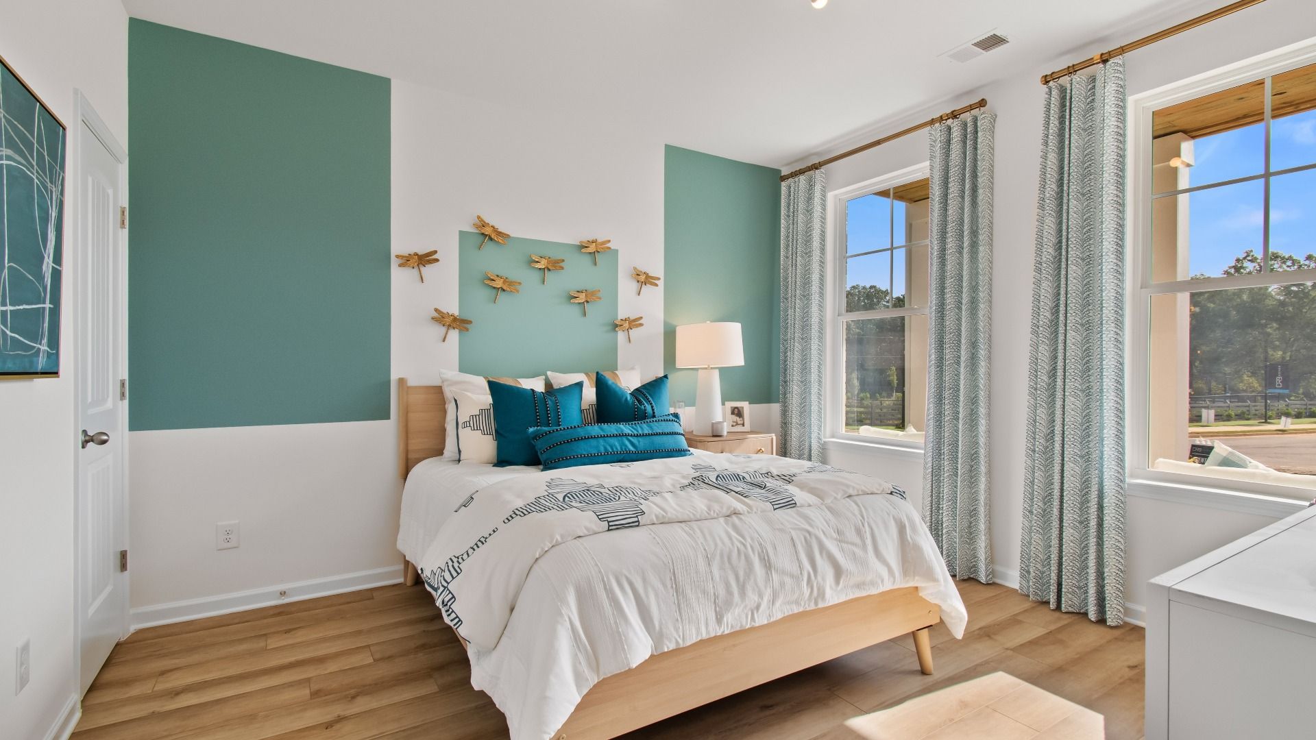 Wagener guest bedroom with natural light and LVP flooring at Burchwood in Stockbridge, GA.