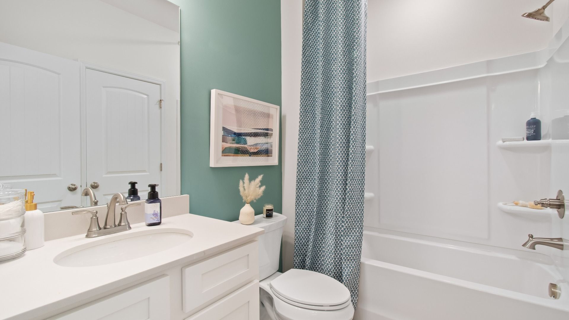 Secondary full bath with shower-tub combo and vanity in the Wagener at Burchwood in Stockbridge, GA.