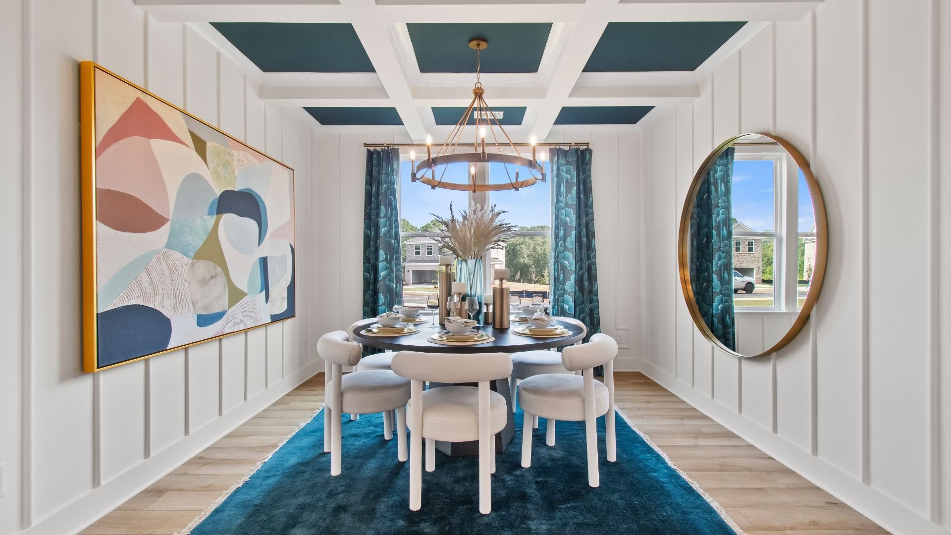 Wagener bright open dining room with coffered ceiling, LVP flooring and modern finishes at Burchwood in Stockbridge, GA.