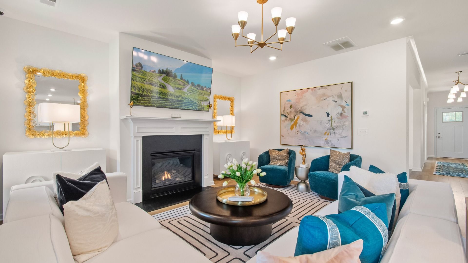 Wagener expansive family room with LVP flooring, gas fireplace, and ample seating area at Burchwood in Stockbridge, GA.