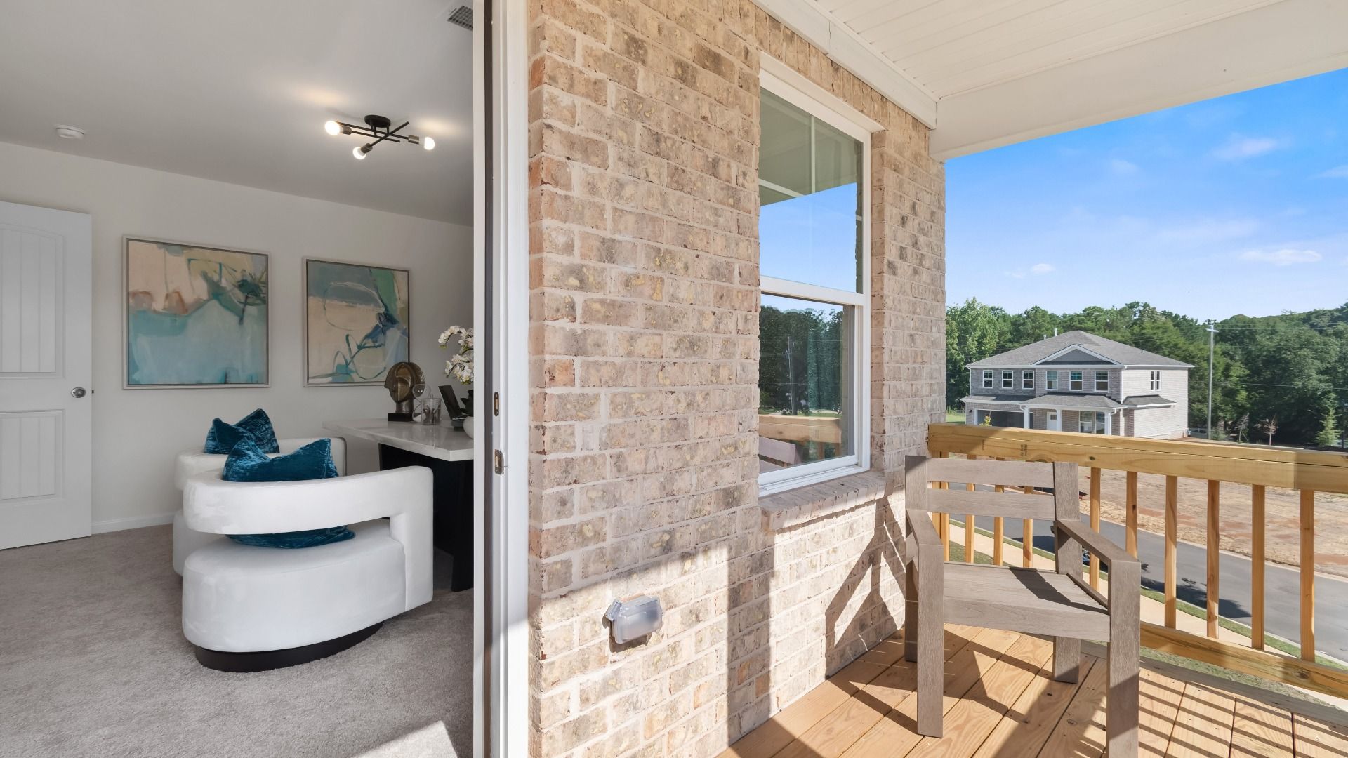 Wagener second floor flex room with balcony access, wood decking, and seating area at Burchwood in Stockbridge, GA.