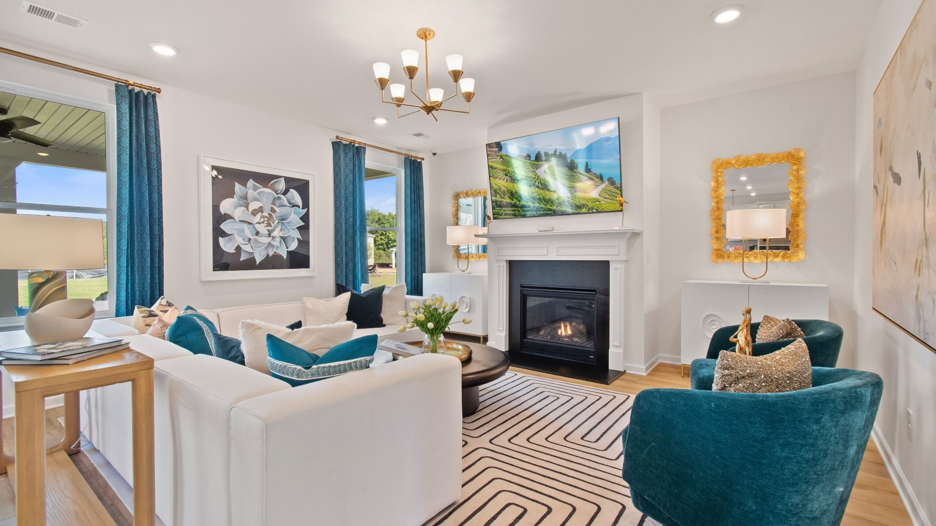 Modern family room with LVP flooring, gas fireplace, and natural light in the Wagener at Bowers Farm in McDonough, GA.