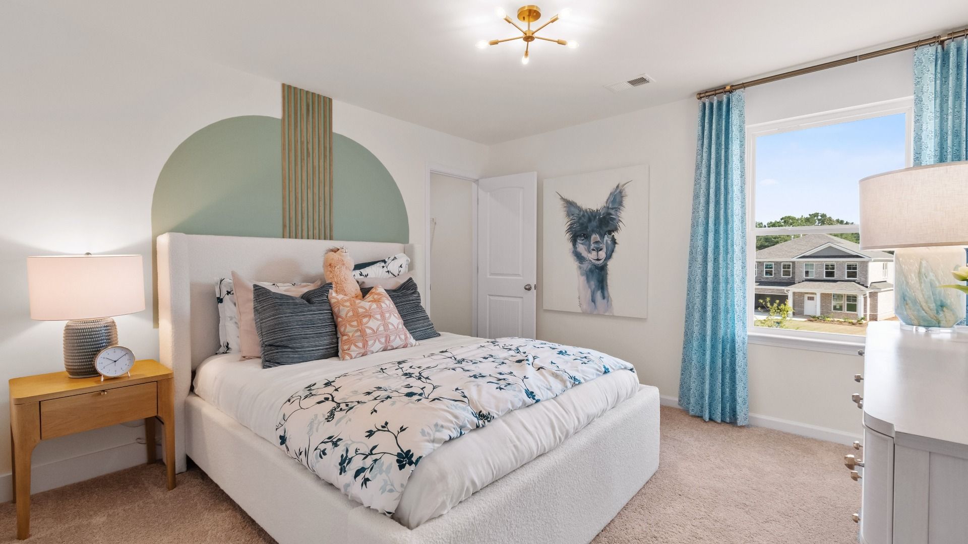 Comfortably sized secondary bedroom with carpet flooring, natural light, and modern finishes in the Wagener at Bowers Farm.
