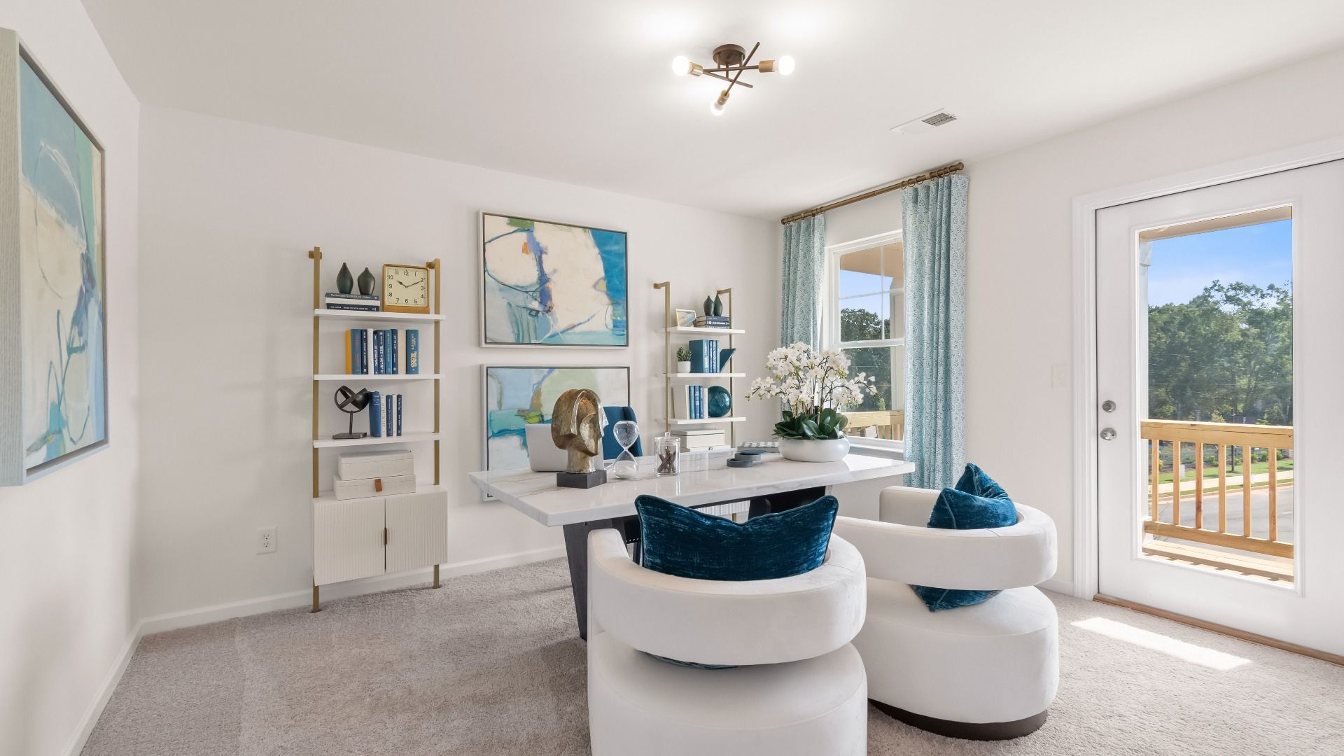 Spacious Wagener secondary bedroom with carpet flooring, natural light, and balcony access at Bowers Farm in McDonough, GA.