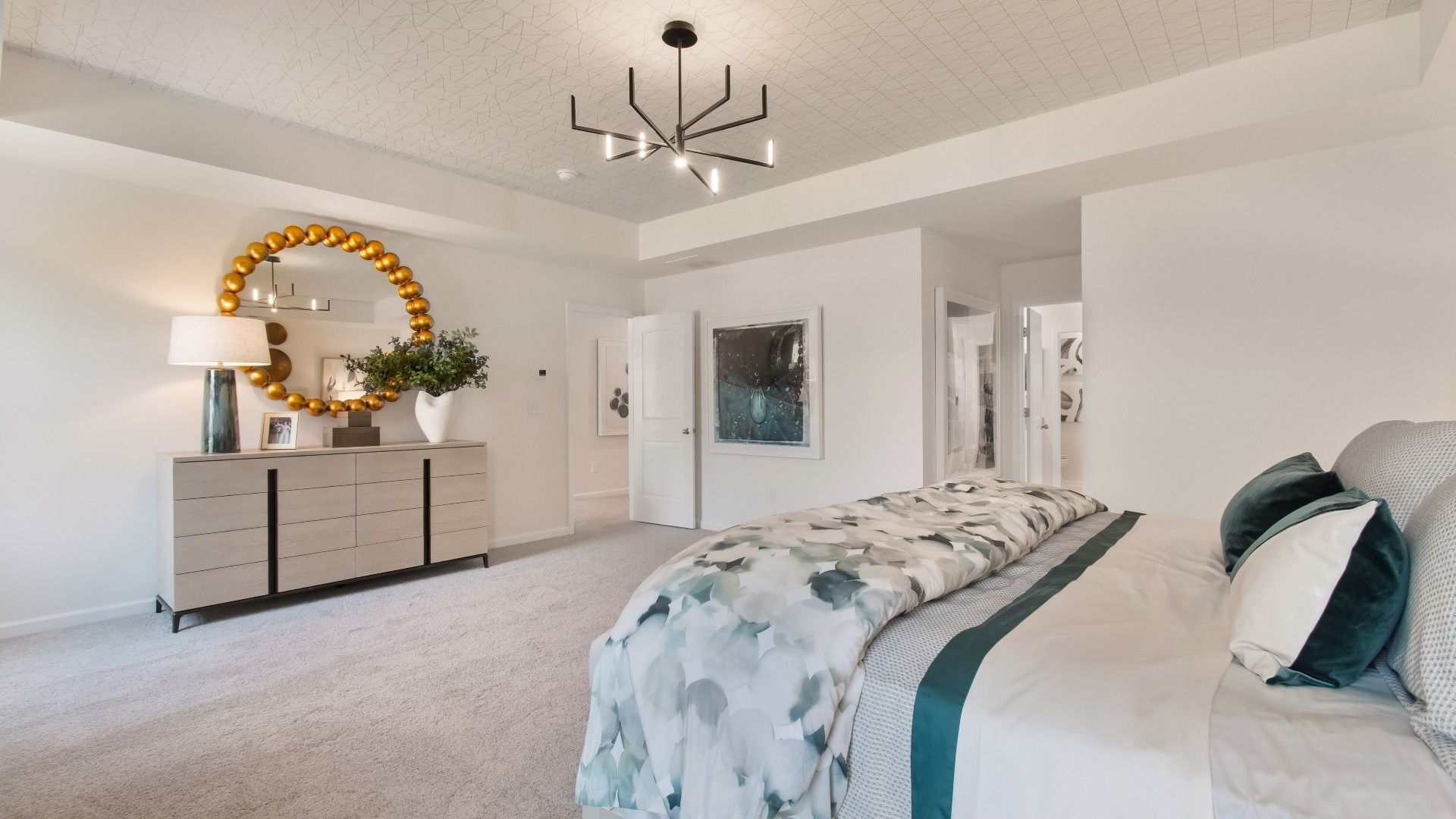 Luxurious Wagener primary suite with spacious room, carpet flooring, and neutral modern finishes at Bowers Farm.