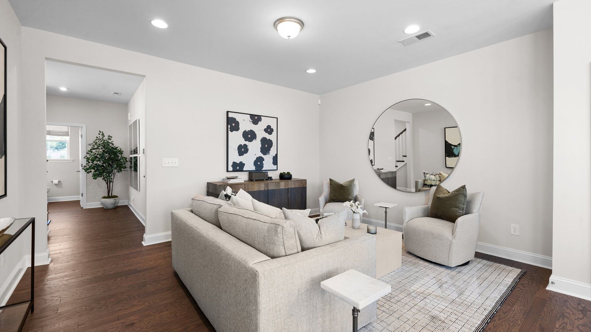 Family room with luxury vinyl plank flooring and elevated ceiling in the Rochester Design by DRB Homes Charlotte, NC