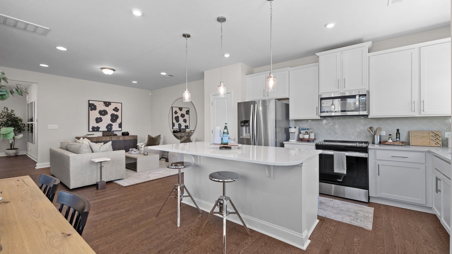 Large kitchen with premium lighting and open concept family room in the new Rochester Design by DRB Homes Charlotte, NC