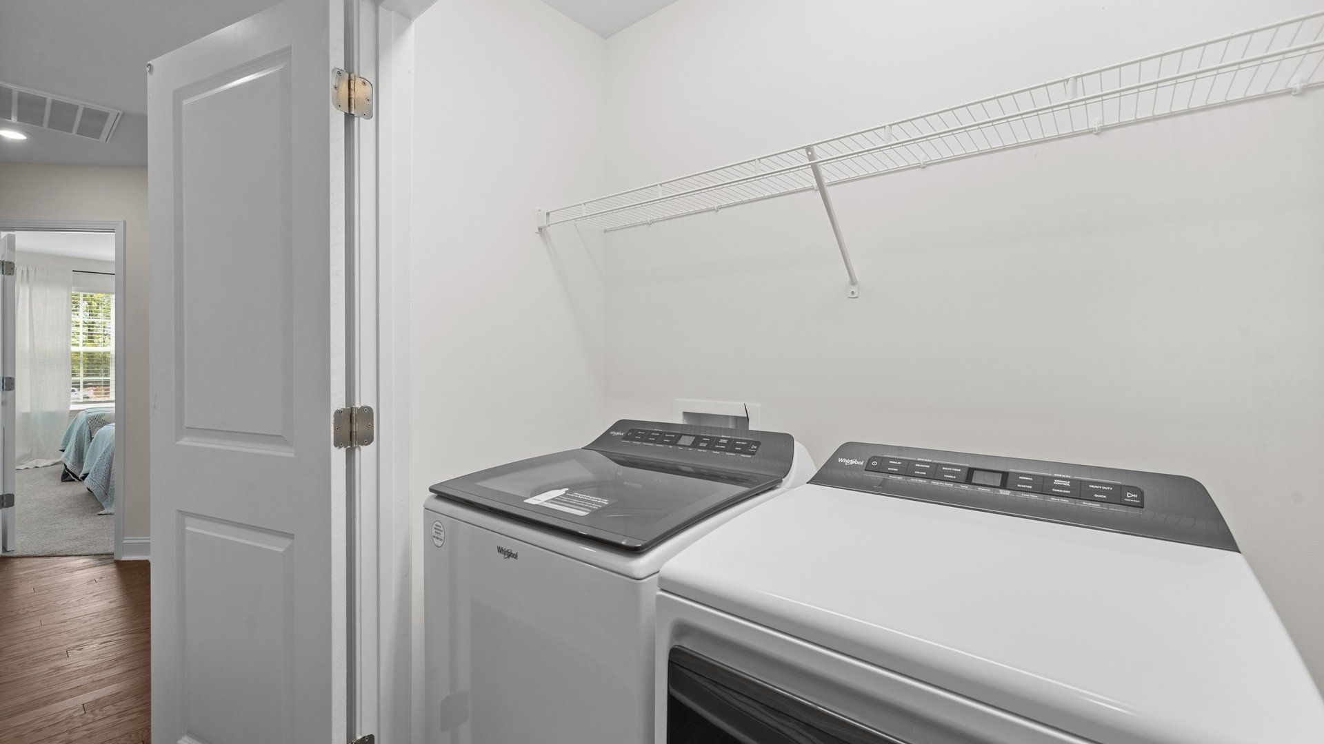 The Rochester laundry closet is conveniently located on the same level as the primary suite. DRB Homes. Charlotte, NC.
