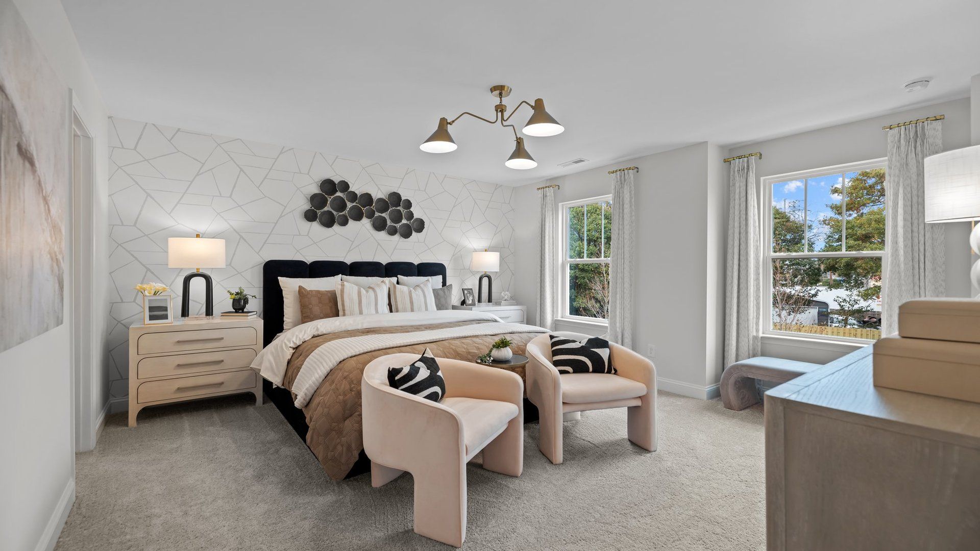 Spacious owner's suite with large windows and plush carpeting in the new Adaline Design by DRB Homes Charlotte, NC