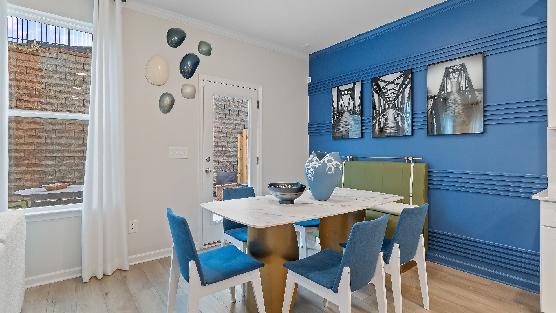 Bright breakfast area in new construction townhome in Riverdale, GA featuring large windows and abundant natural light.