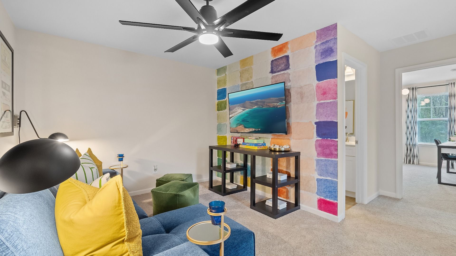 Spacious upstairs loft in new construction townhome for flexible office or lounge use at Auburn Ridge in Riverdale, GA.