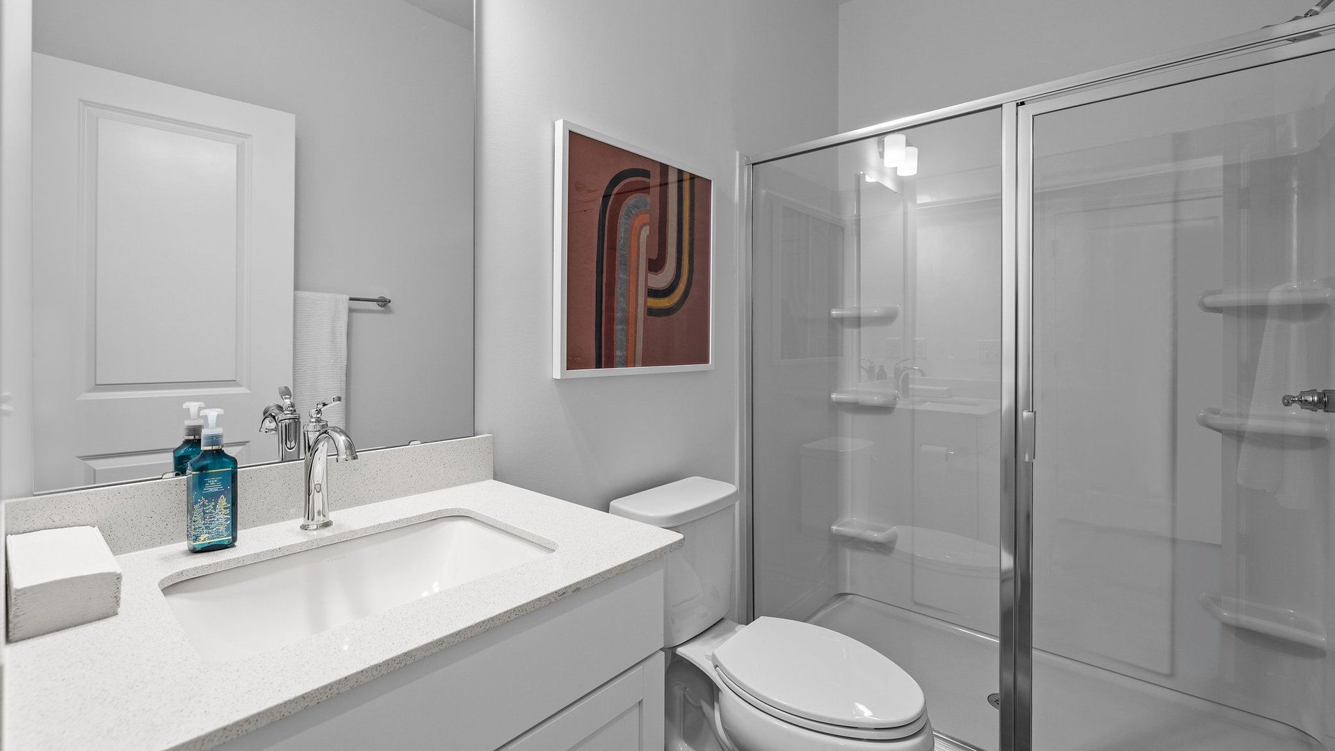 Bathroom on the main level with walk-in shower and undermount sink in The Landon Design by DRB Homes in Charlotte, NC