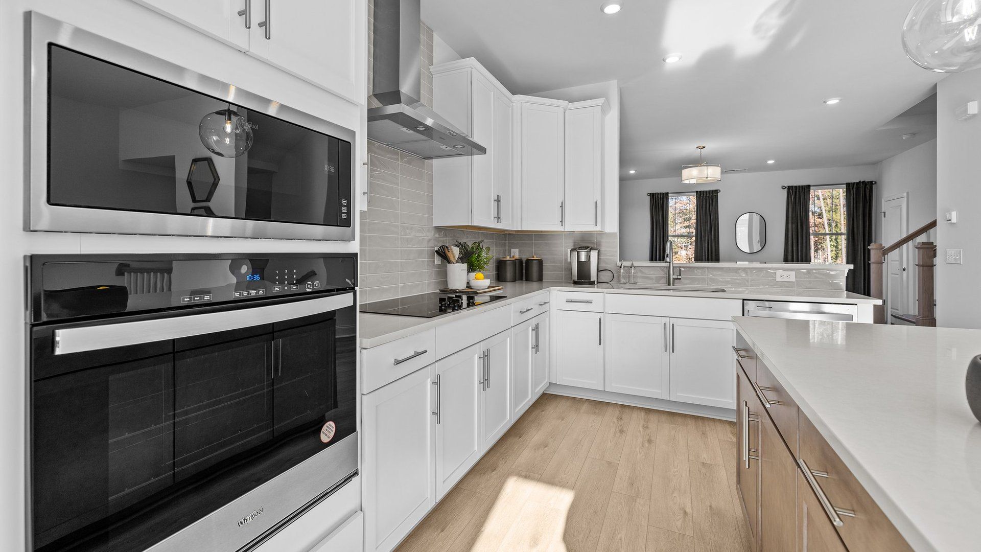 Gourmet kitchen with wall oven/microwave, vented hood, and 42" cabinets, in the Landon Plan by DRB Homes Charlotte, NC