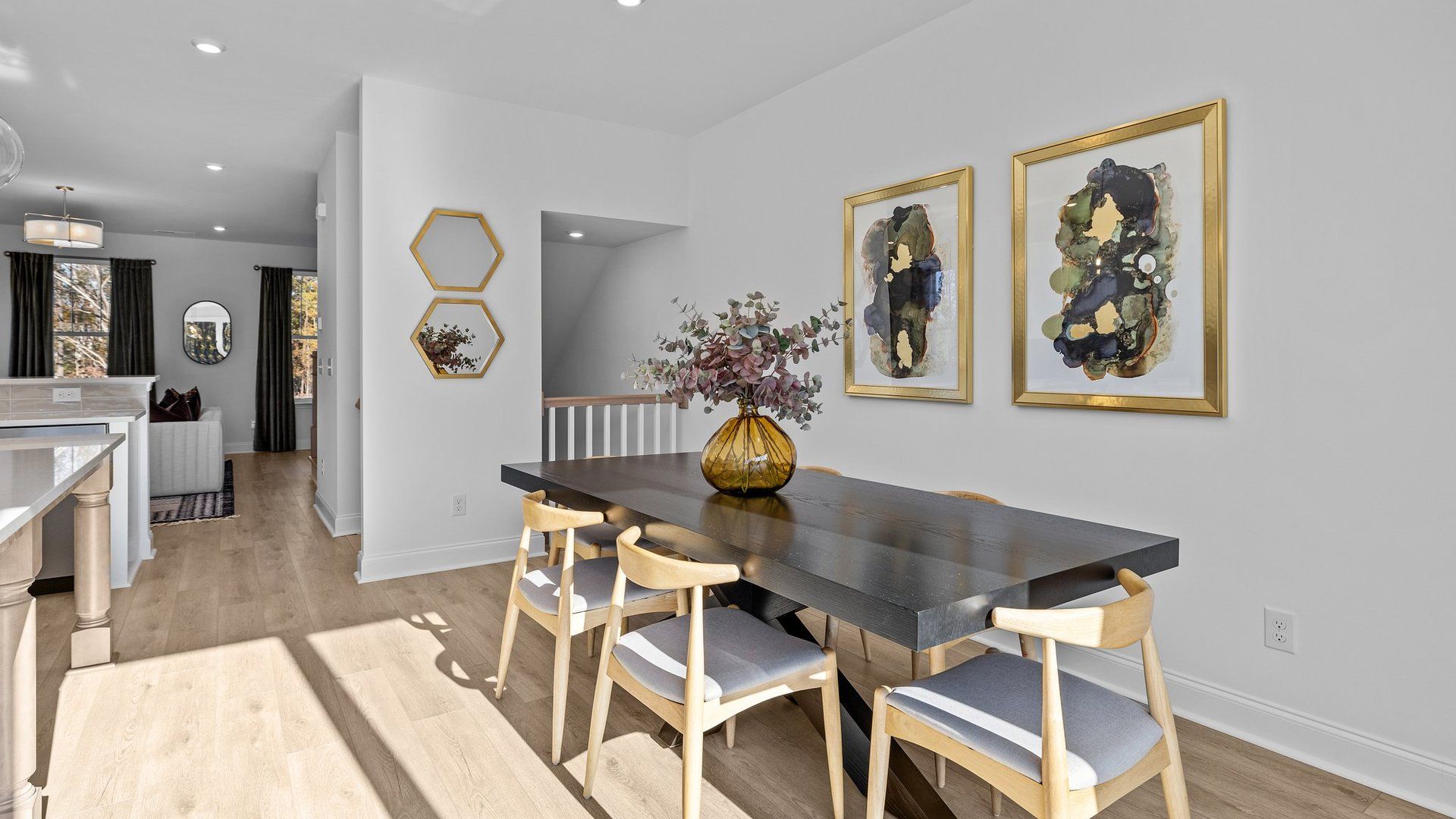 Open concept dining area with elevated ceiling and premium finishes in The Landon Plan by DRB Homes Charlotte, NC