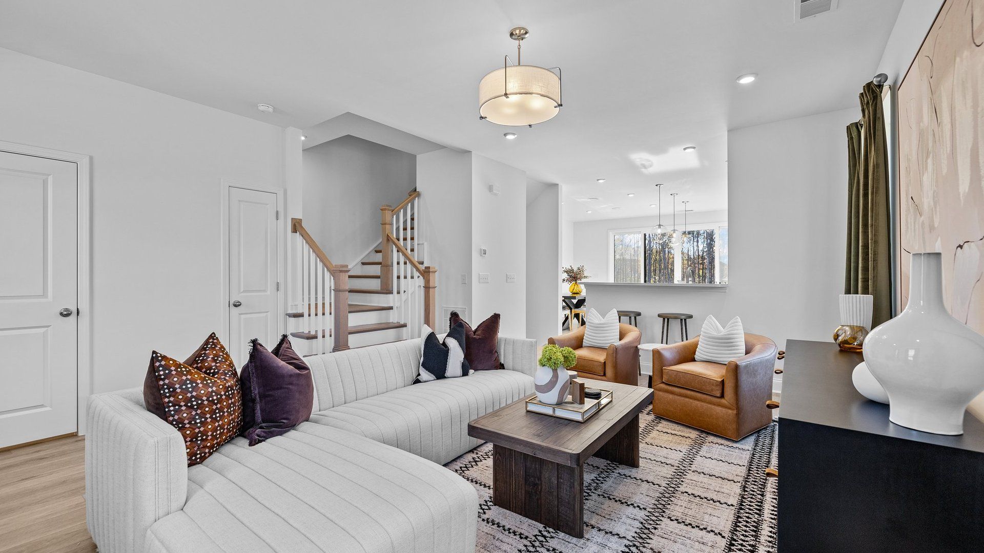Ample open concept family room with elevated ceiling and premium finishes in The Landon Plan by DRB Homes Charlotte, NC