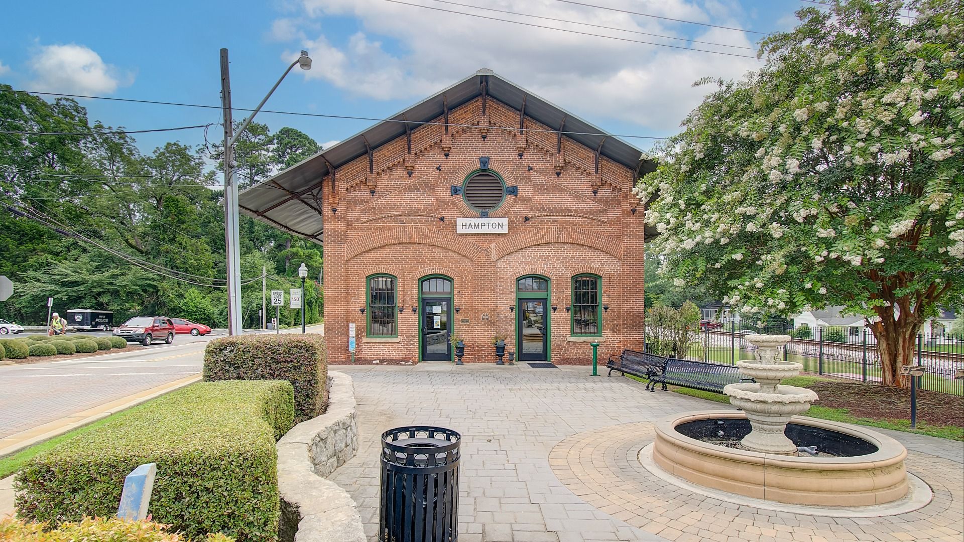 Hampton train station with fountain and bench seating in Hampton, GA near Cambria at Traditions.