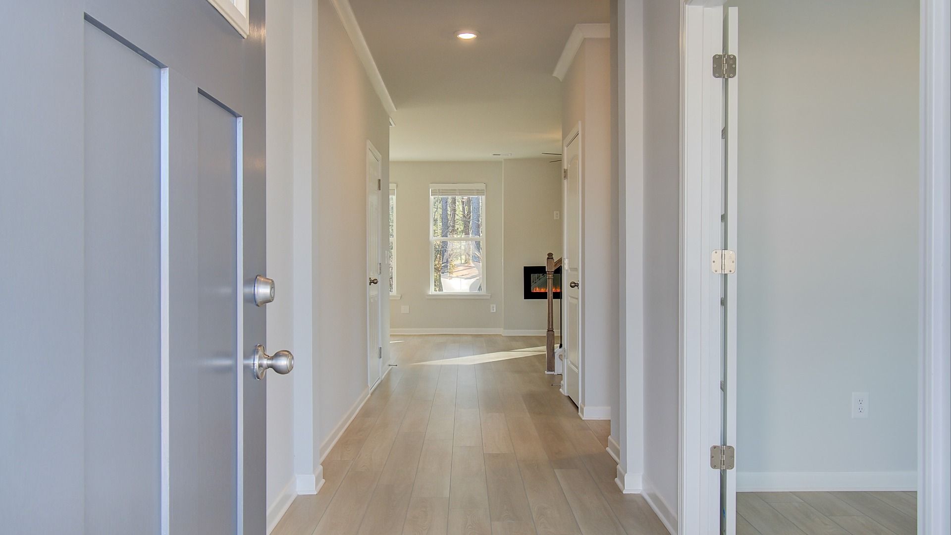 Pelham entry into open foyer with LVP flooring at new construction Bowers Farm in McDonough, GA.