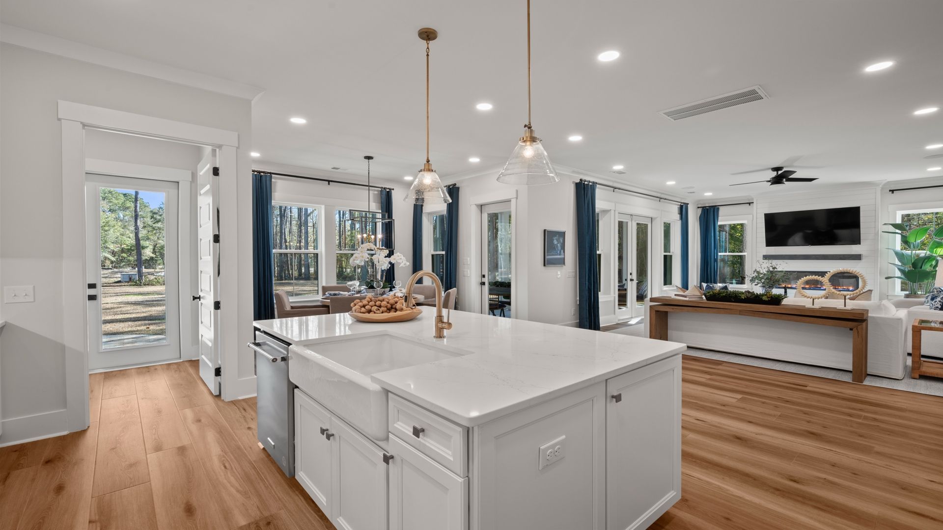 Kitchen- at Pamlico Terrace at by DRB Homes features an amazing kitchen island and gorgeous light fixtures