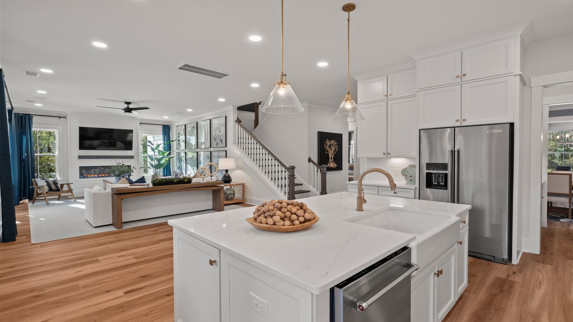 Kitchen- at Pamlico Terrace at by DRB Homes features an amazing kitchen island and gorgeous light fixtures