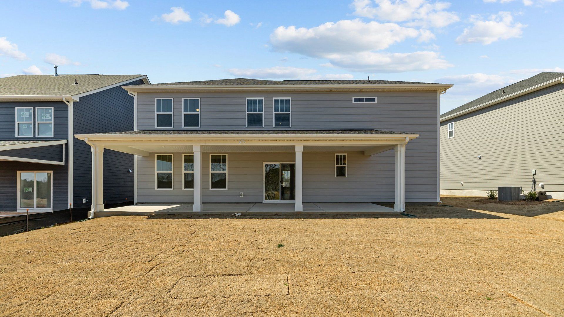 Norris Design expansive rear covered porch. At Lakeside Glen by premier builder DRB Homes in York, SC.