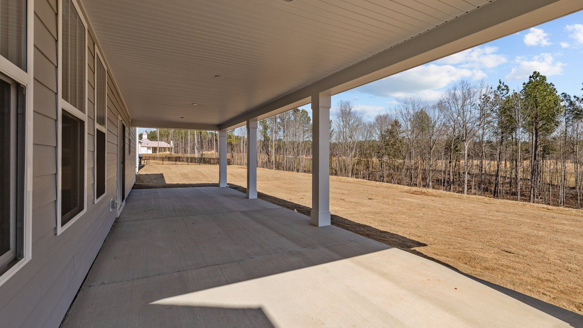 Norris Design expansive rear covered porch. At Lakeside Glen by premier builder DRB Homes in York, SC.
