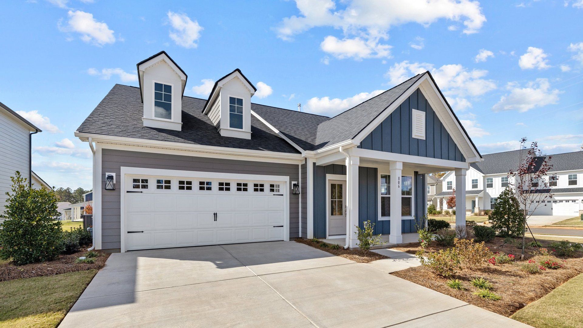 Fairfield design front elevation with rocking chair covered front porch at Lakeside Glen by DRB Homes, York, SC.
