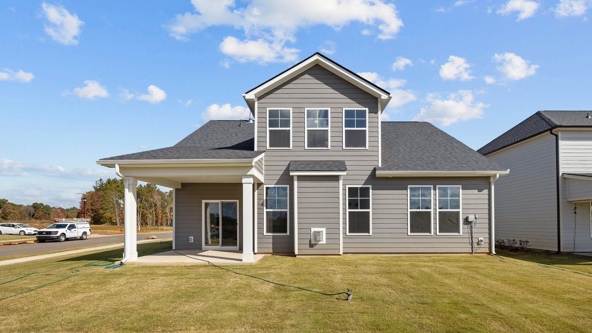 Fairfield design rear elevation with covered rear porch at Lakeside Glen by premier builder DRB Homes, York, SC.