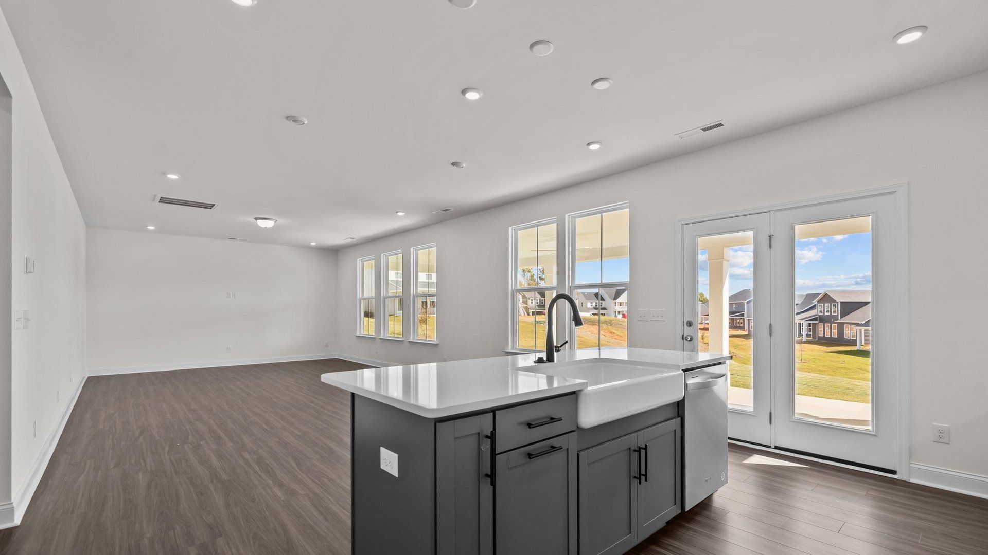 Burton Design open floor concept with plentiful windows for abundant natural light. At Lakeside Glen by DRB Homes, York, SC