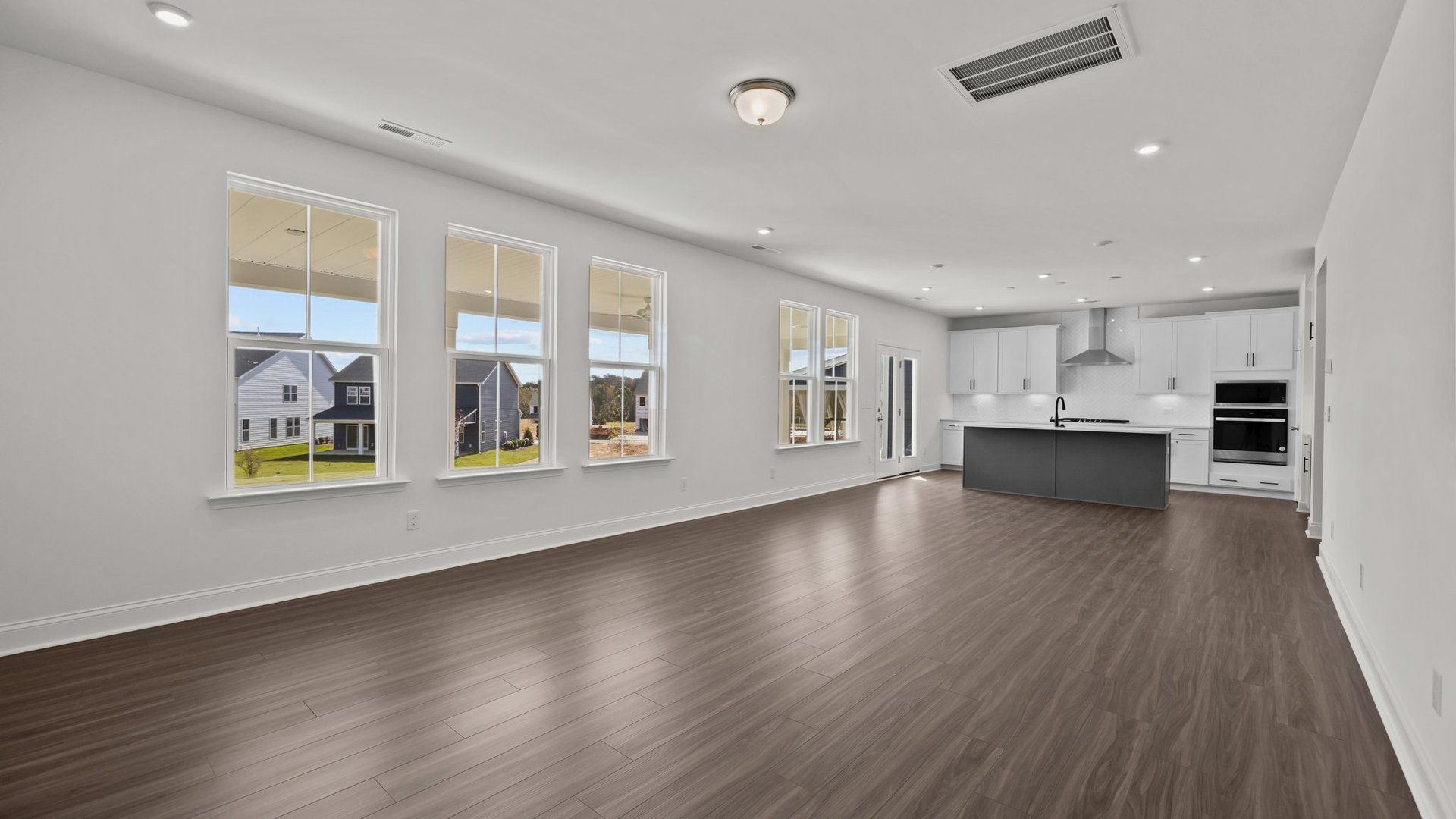 Burton Design open concept with large windows for abundant natural light. At Lakeside Glen by DRB Homes, York, SC