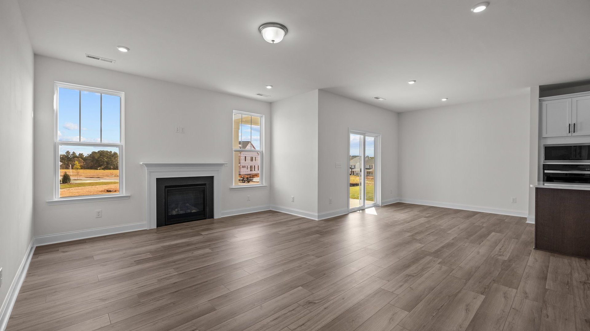 Fairfield design open concept family room, eat-in breakfast, and gourmet kitchen at Lakeside Glen by DRB Homes, York, SC.