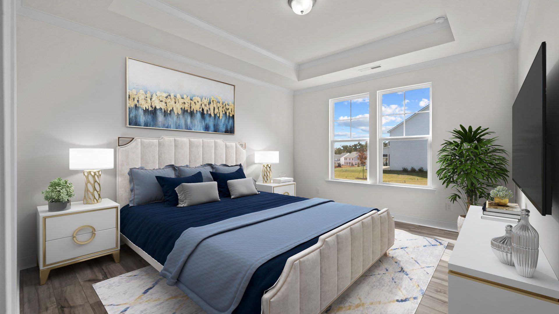 Fairfield spacious primary bedroom with raised tray ceiling and large windows. at Lakeside Glen by DRB Homes, York, SC.
