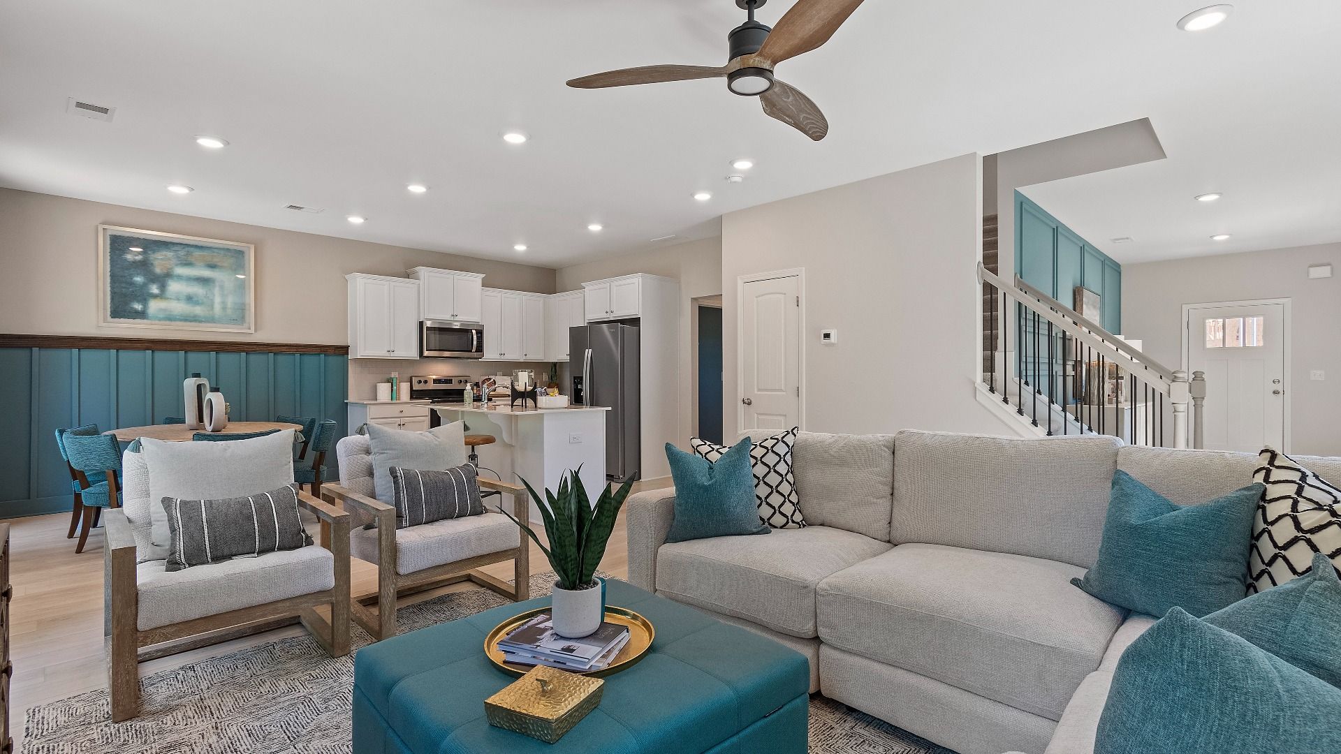 Open concept first level with seamless flow between kitchen and family room at Abbotts Crossing single family home.