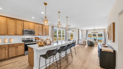 Kitchen in Chestnut Farms in by DRB homes offering an open layout